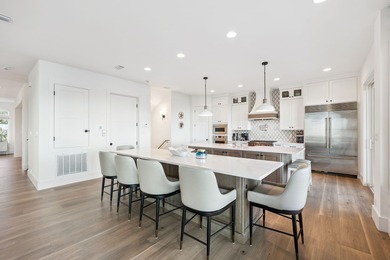 Completed in 2024, this stunning harborfront home offers the