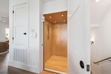 Completed in 2024, this stunning harborfront home offers the