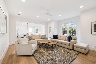 Completed in 2024, this stunning harborfront home offers the