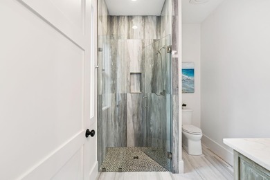 Completed in 2024, this stunning harborfront home offers the