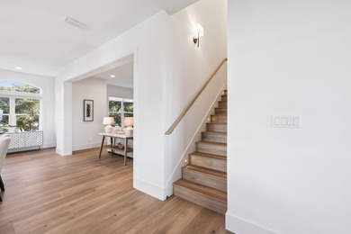 Completed in 2024, this stunning harborfront home offers the