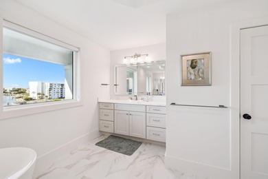 Completed in 2024, this stunning harborfront home offers the