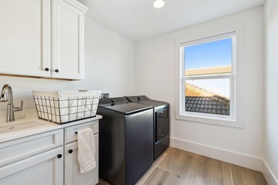 Completed in 2024, this stunning harborfront home offers the