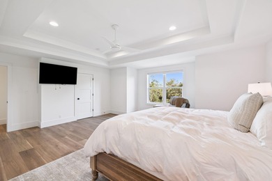 Completed in 2024, this stunning harborfront home offers the