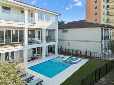 Completed in 2024, this stunning harborfront home offers the