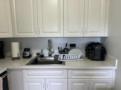 Beautiful 2 bedroom condo with a covered screened porch with new