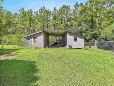 This Monticello gem truly has it all! Situated on 1.8