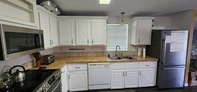Manufactured Home on leased land with lot rent. This beautifully