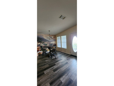 Manufactured Home on leased land with lot rent. This beautifully