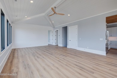 Discover unparalleled coastal living in this stunning newly