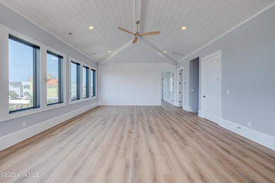 Discover unparalleled coastal living in this stunning newly