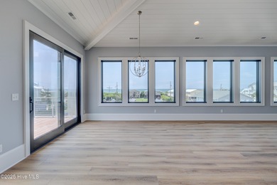 Discover unparalleled coastal living in this stunning newly