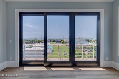 Discover unparalleled coastal living in this stunning newly