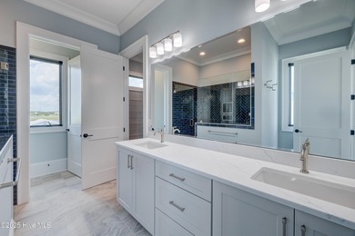 Discover unparalleled coastal living in this stunning newly