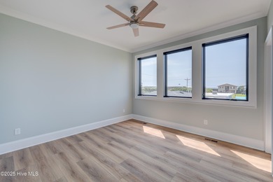 Discover unparalleled coastal living in this stunning newly