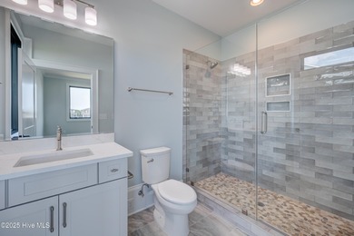 Discover unparalleled coastal living in this stunning newly