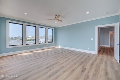 Discover unparalleled coastal living in this stunning newly