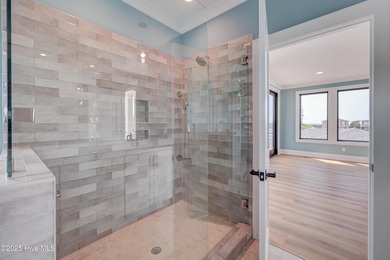 Discover unparalleled coastal living in this stunning newly