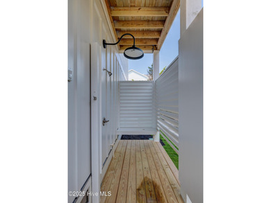 Discover unparalleled coastal living in this stunning newly