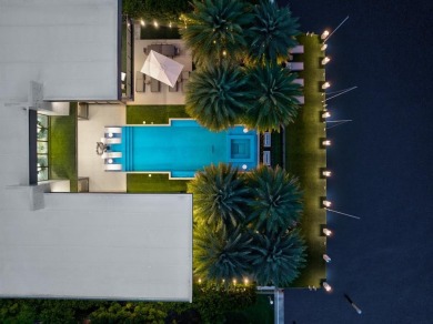 An unparalleled gated waterfront estate located on the deep