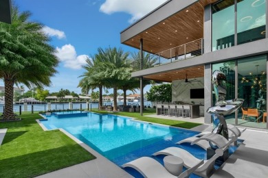 An unparalleled gated waterfront estate located on the deep