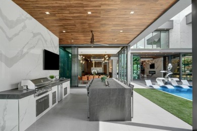 An unparalleled gated waterfront estate located on the deep