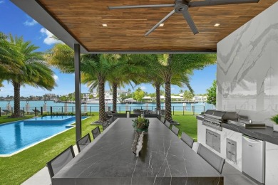 An unparalleled gated waterfront estate located on the deep