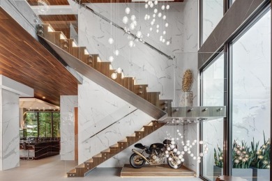 An unparalleled gated waterfront estate located on the deep