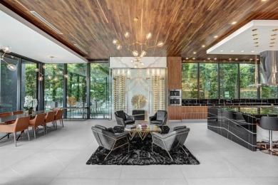 An unparalleled gated waterfront estate located on the deep