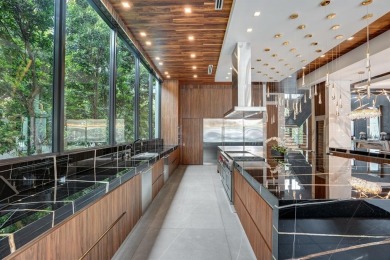 An unparalleled gated waterfront estate located on the deep