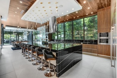 An unparalleled gated waterfront estate located on the deep