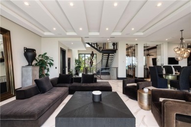 The largest estate in the community, this oceanfront masterpiece