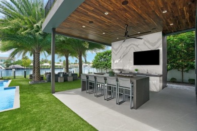 An unparalleled gated waterfront estate located on the deep