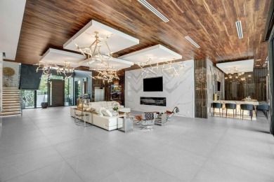 An unparalleled gated waterfront estate located on the deep