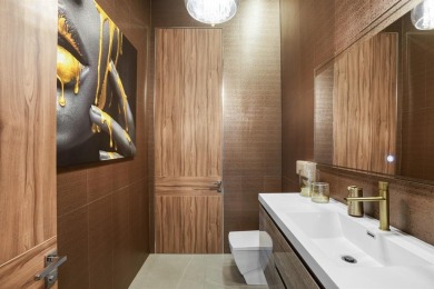 An unparalleled gated waterfront estate located on the deep