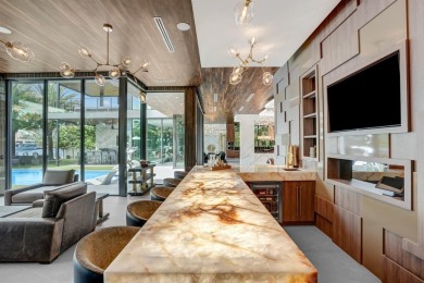 An unparalleled gated waterfront estate located on the deep