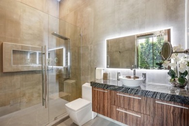 An unparalleled gated waterfront estate located on the deep