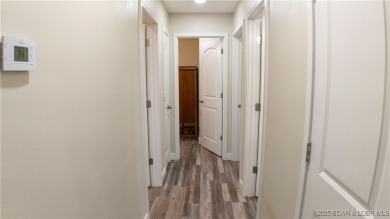 ABSOLUTELY STUNNING lake home right off of Hwy UU and just 3.4