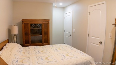 ABSOLUTELY STUNNING lake home right off of Hwy UU and just 3.4