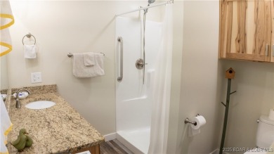 ABSOLUTELY STUNNING lake home right off of Hwy UU and just 3.4