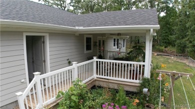 ABSOLUTELY STUNNING lake home right off of Hwy UU and just 3.4