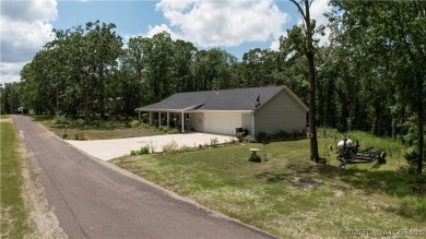 ABSOLUTELY STUNNING lake home right off of Hwy UU and just 3.4