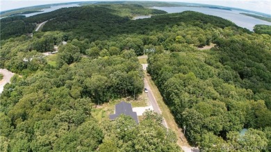 ABSOLUTELY STUNNING lake home right off of Hwy UU and just 3.4