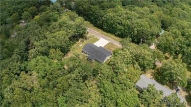 ABSOLUTELY STUNNING lake home right off of Hwy UU and just 3.4