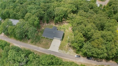ABSOLUTELY STUNNING lake home right off of Hwy UU and just 3.4