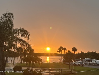 Wake up to gorgeous river views in this bright and breezy