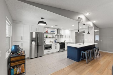 Welcome home to 2420 Osprey Ave, Palm Harbor, FL 34683. Totally