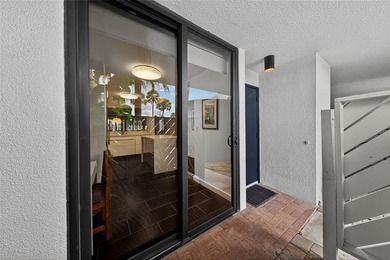 RESORT STYLE, BOUTIQUE CONDO FEATURES ASSIGNED BOAT DOCK FOR