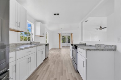 **SHORT SALE!** Light-filled corner home on the Caloosahatchee