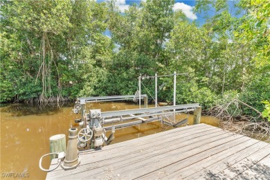 **SHORT SALE!** Light-filled corner home on the Caloosahatchee